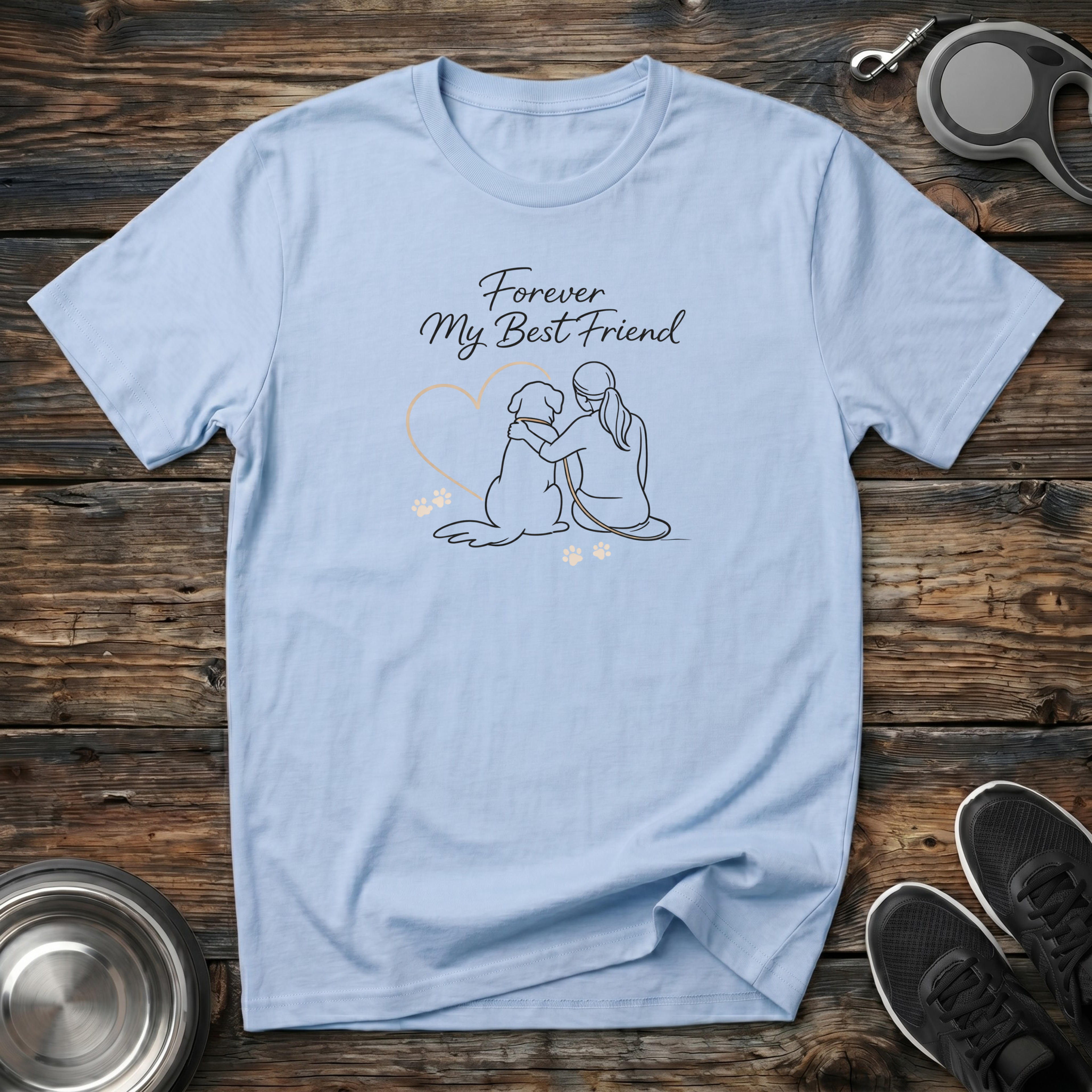 Forever My Best Friend powder blue t-shirt with breathtaking
delicate line art of girl and dog sitting together inside heart
with golden paw prints and flowing script typography