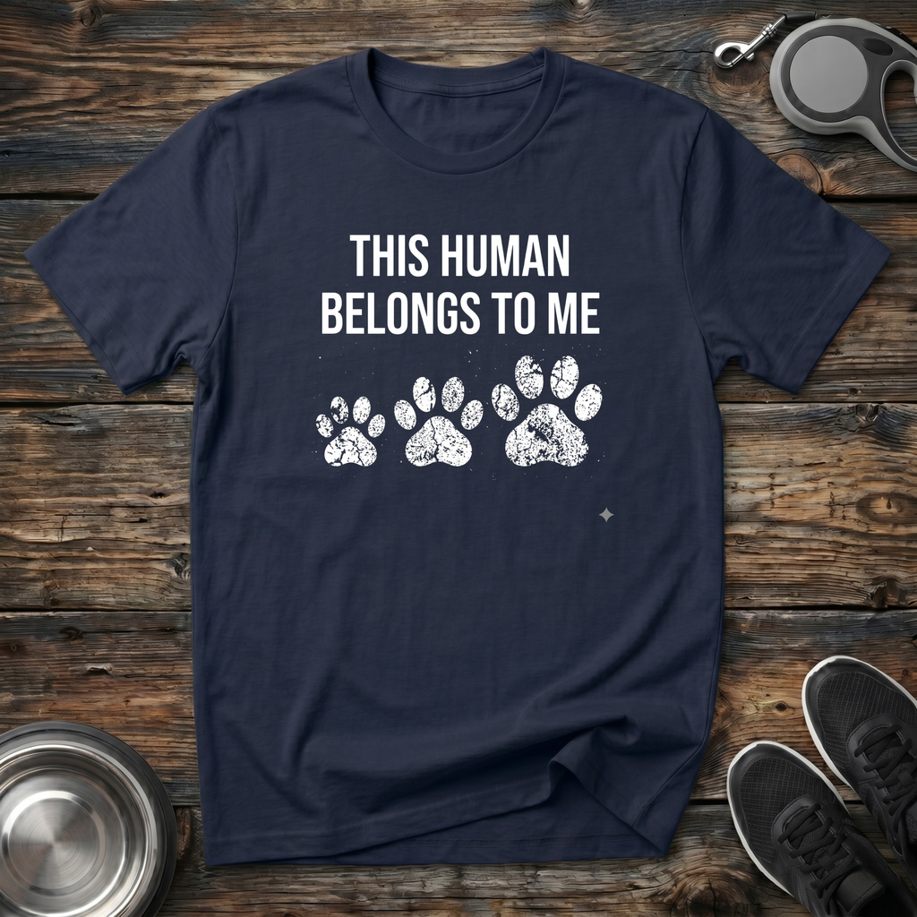 This Human Belongs To Me Funny Dog Owner T-Shirt – Bold Paw Print Graphic Tee Told From the Dog's Perspective