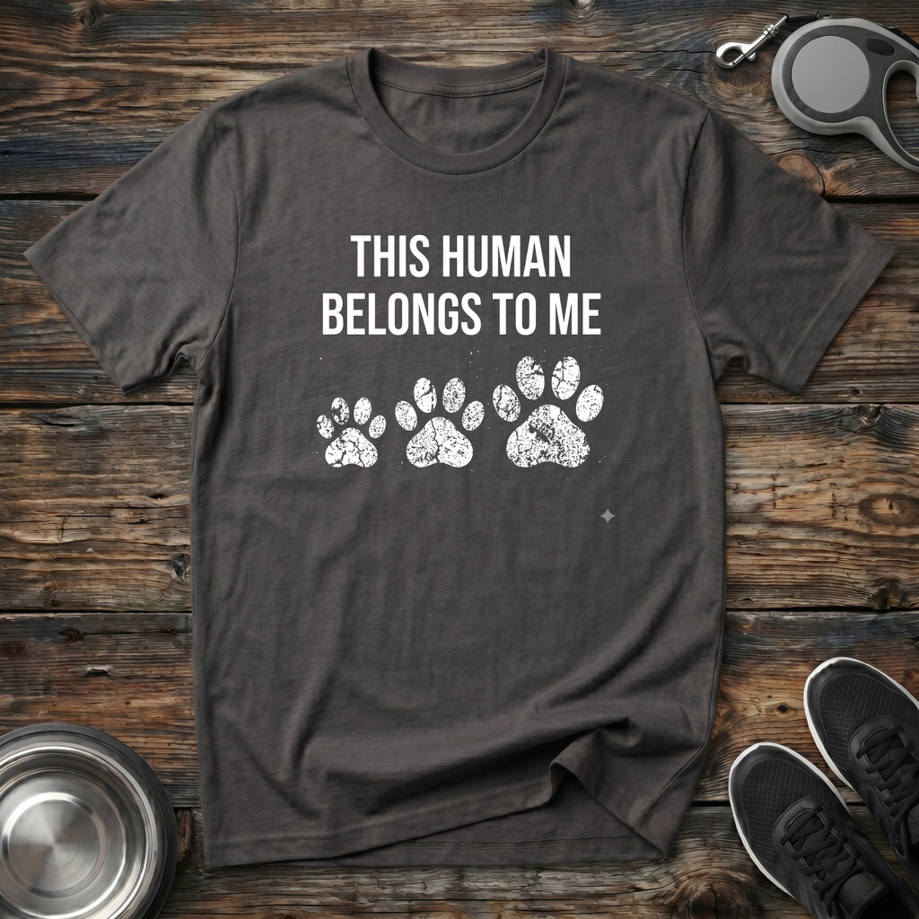 This Human Belongs To Me Funny Dog Owner T-Shirt – Bold Paw Print Graphic Tee Told From the Dog's Perspective