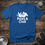 Bold royal blue unisex t-shirt with white rolling dog illustration and "Paws & Chill" lettering — funny dog lover gift tee for pet parents and dog moms