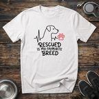 Rescued is My Favourite Breed white t-shirt with beautiful
minimal heartbeat dog silhouette line art and red paw print accent,
rescue dog lover tee and adopt don't shop gift