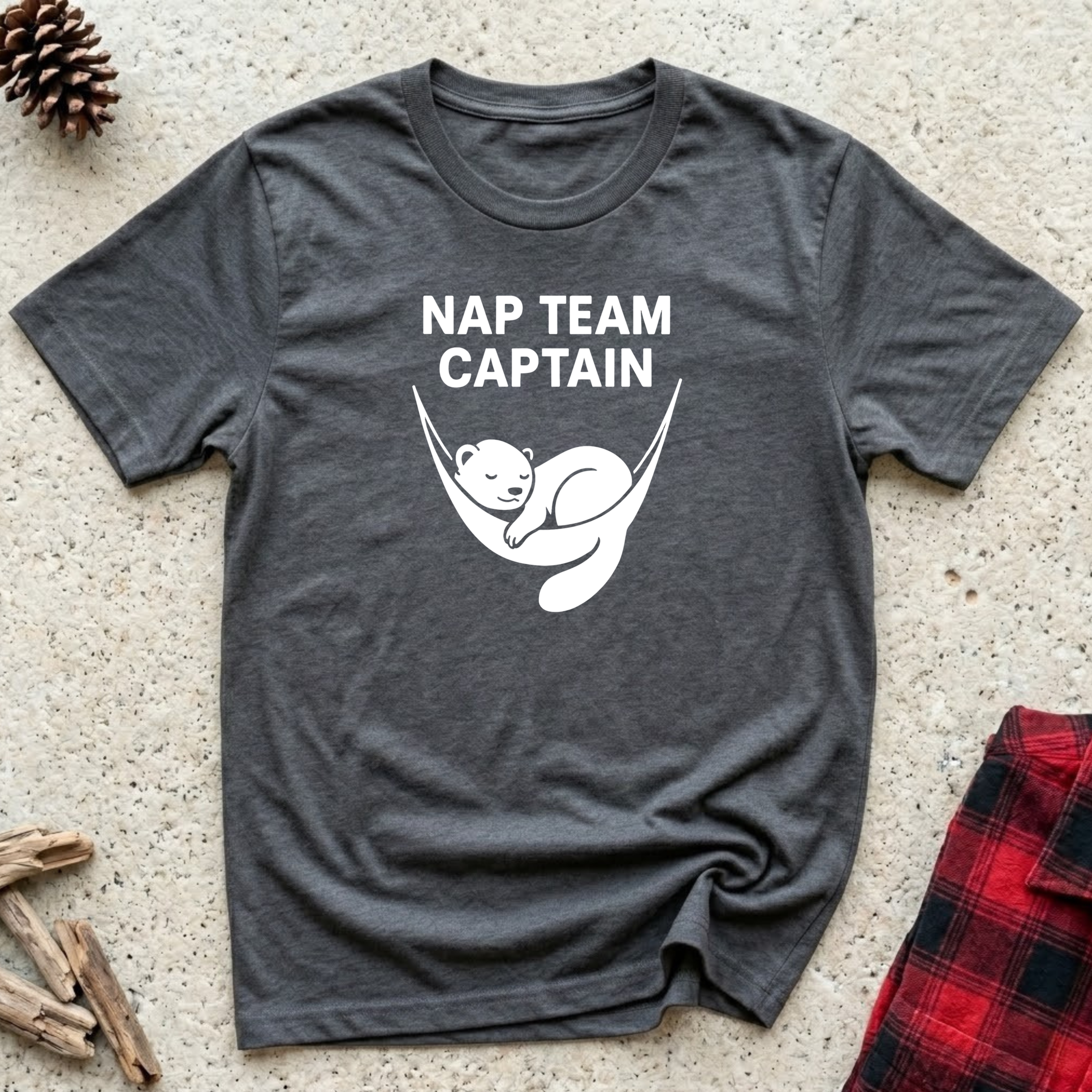 Nap Team Captain charcoal t-shirt with adorable clean white
sleeping otter curled in hammock pose, funny pet lover nap tee
and cat mom dog mom lazy day gift