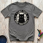 I Like Cats More Than People charcoal t-shirt with bold vintage
distressed badge featuring grumpy crossed-arms black and white cat,
funny cat lover tee and introvert cat gift