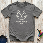 Meow Mode On military olive t-shirt with simple distressed
chalk-style cat face and bold text in weathered white,
funny minimalist cat lover tee and cat mom dad gift