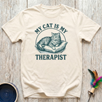 My Cat is My Therapist cream t-shirt with stunning vintage
engraving style tabby cat on cushion in rich teal lettering,
funny emotional cat lover tee and cat mom mental health gift