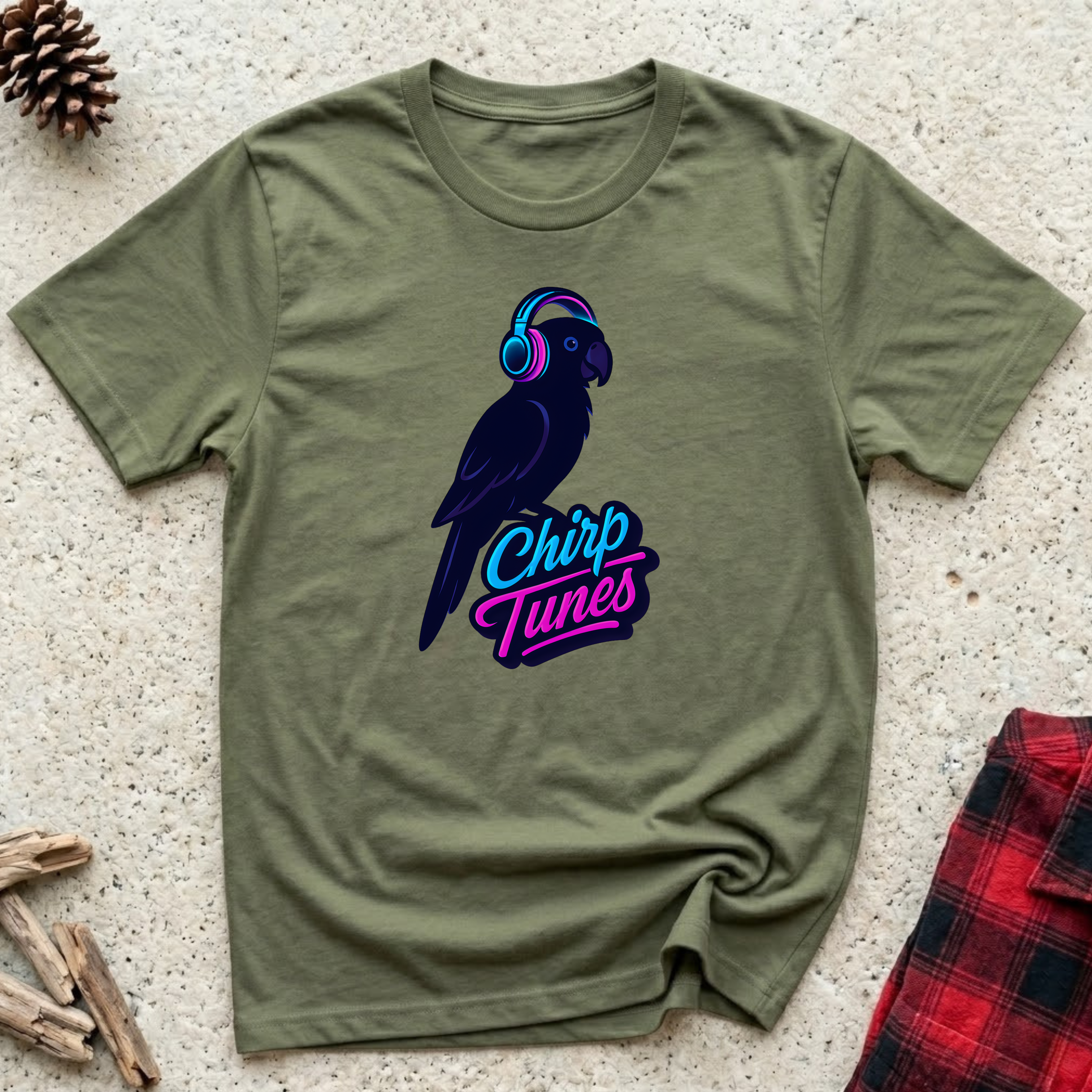 Chirp Tunes olive green t-shirt with sleek dark parrot wearing
neon pink and blue headphones in bold synthwave style,
cool bird lover music tee and parrot owner gift
