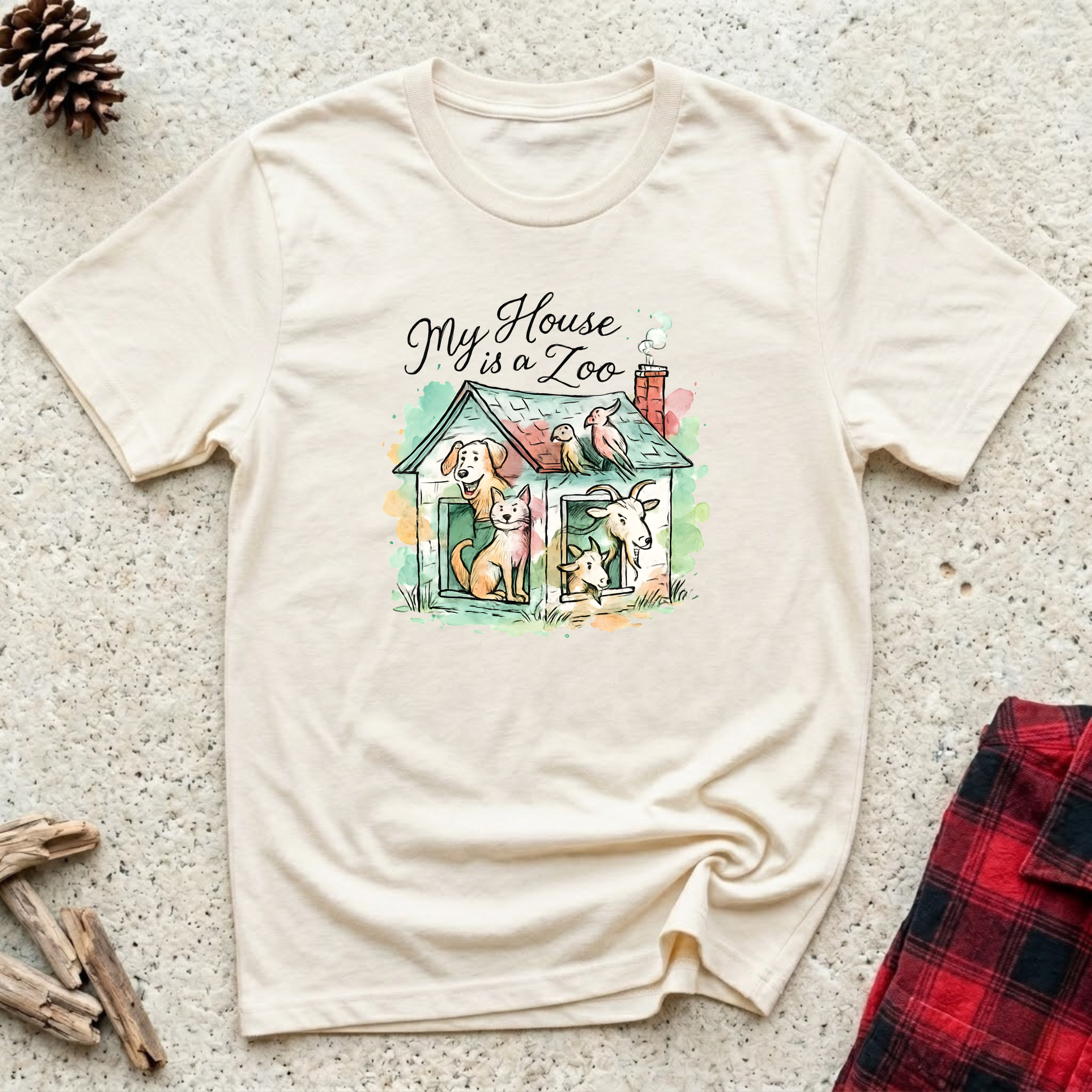 My House is a Zoo cream t-shirt with charming watercolor
illustration of multiple pets in a cozy house, funny multi pet owner tee
and animal lover gift