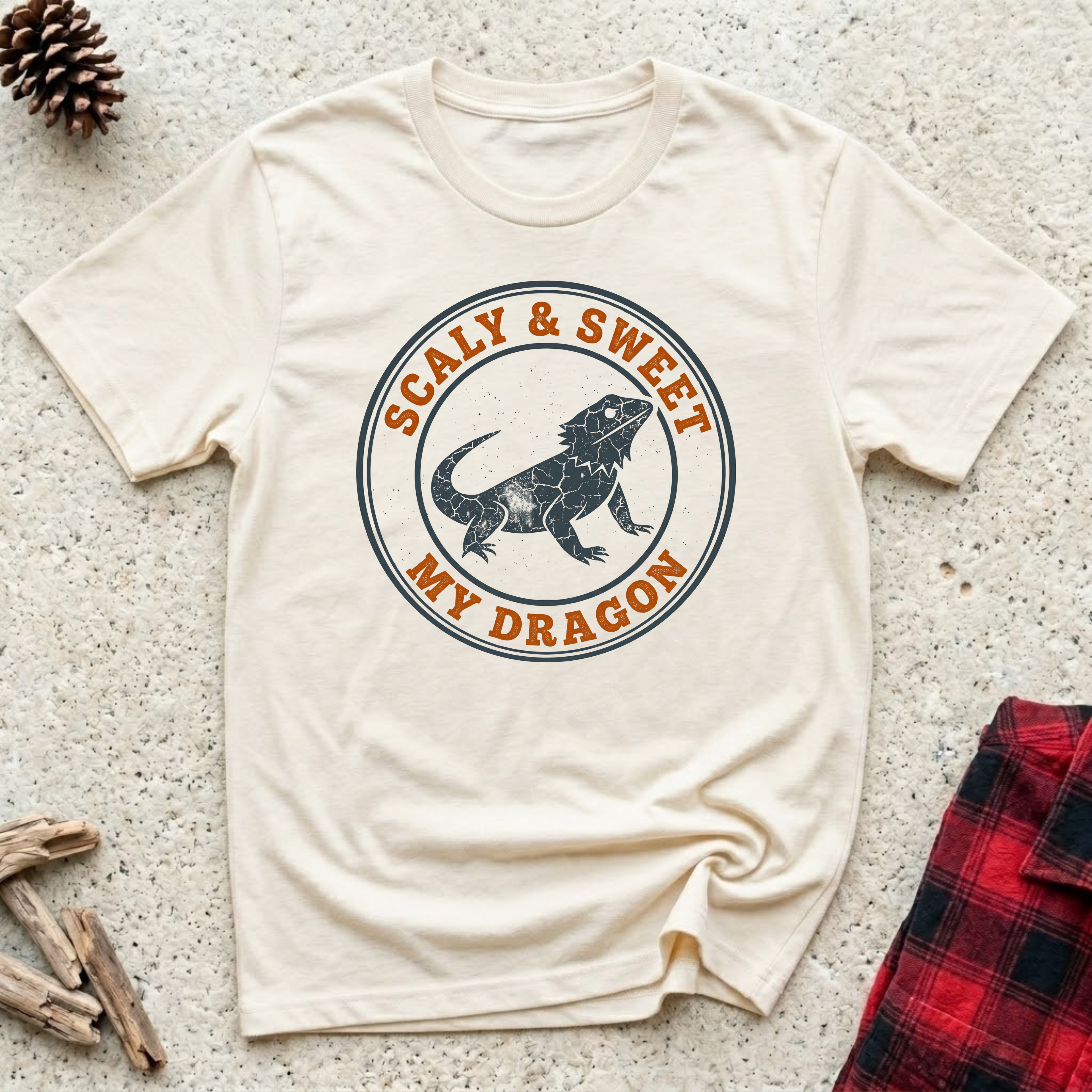 Scaly and Sweet My Dragon cream t-shirt with vintage distressed
badge bearded dragon silhouette in slate blue and burnt orange,
funny beardie lover tee and reptile owner gift