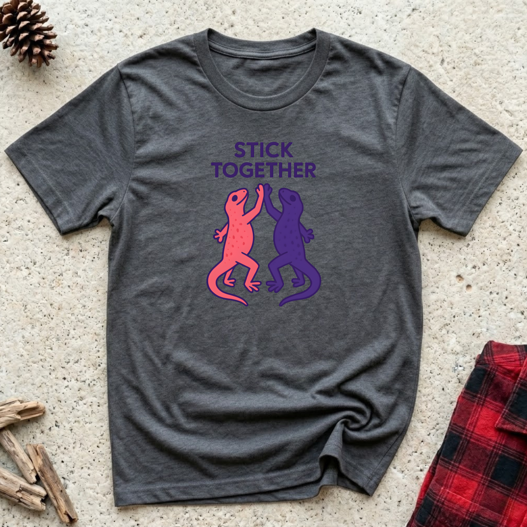 Stick Together charcoal t-shirt with two geckos high fiving
in pink and purple, funny gecko lover tee and reptile owner gift mom gift dad gift