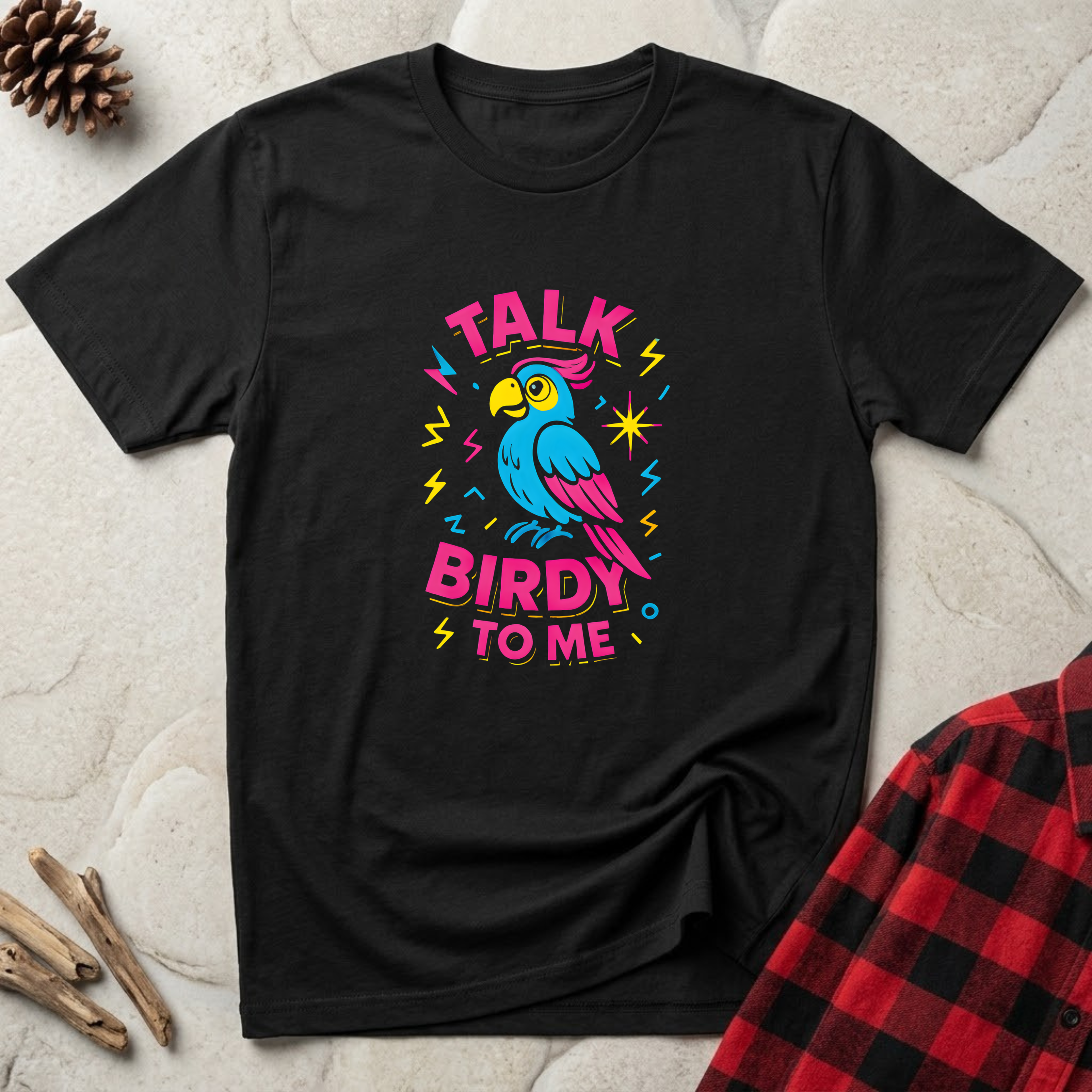 Talk Birdy to Me black t-shirt with vibrant retro blue parrot
design in pink yellow and blue, funny bird lover tee and parrot owner gift